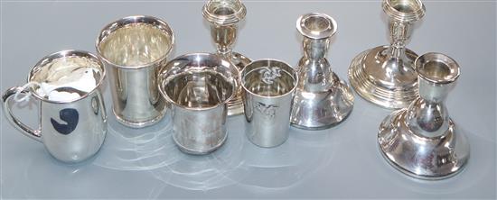 Four assorted Continental white metal beakers including German and Dutch and two pairs of dwarf candlesticks